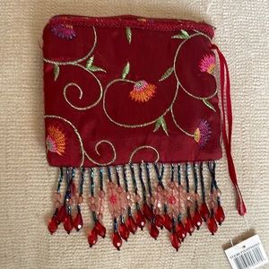Embroidered and beaded change purse. 4.5” x 4” zipper closure. Inside satin.
